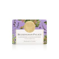 bar of soap wrapped in purple paper printed with lavender and sandalwood plant. There is also a gold seal with a crown and a white box saying 'Buckingham Palace Lavender and Sandalwood Premium English Soap Handmade in London'