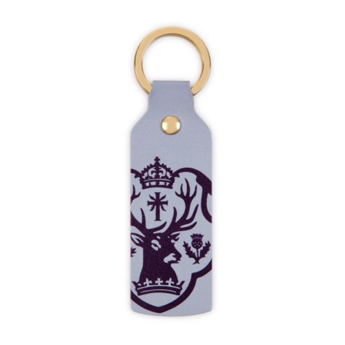 Front of keyring with purple Palace of Holyroodhouse crest against lilac background. 