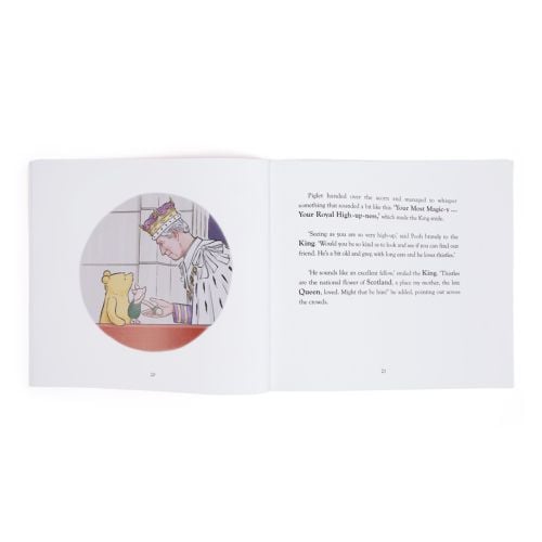 Red childrens book with Winnie-the-Pooh Meets The King" as main title featuring an illustrtaion of Winnie-The-Pooh, Piglet and His Majest the King. 