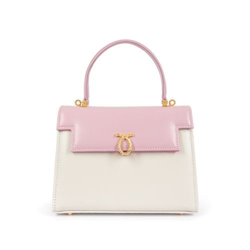 A pink and cream leather handbag with top handle and gold coloured clasp