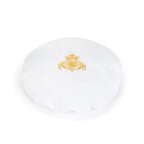 White shower cap with gold embroidered crest. 