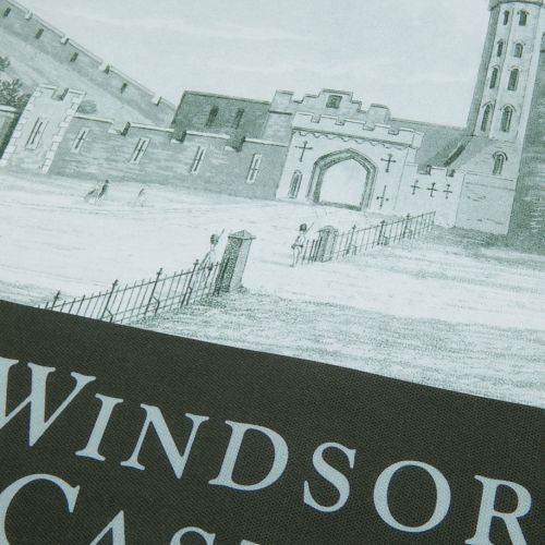 Green coloured tea towel with a detailed facade of Windsor Castle with text at the bottom. 