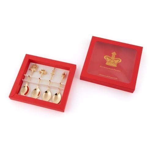 Gold Tea Spoons with various figures on the top, including royal crest, golden carriage, Gaurdsman and Crown in red packaging. 