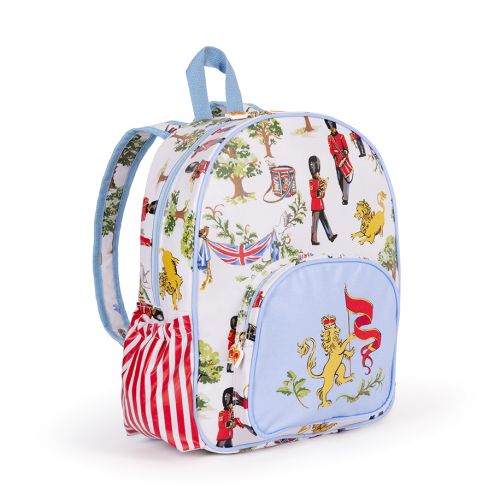 The Children's Royal Guard Backpack, featuring the new designs with Royal Guards marching through the woods trumpeting and drumming, as well lions  with the floral symbols of the four British nations and trees.  The front pocket is blue and features a lio