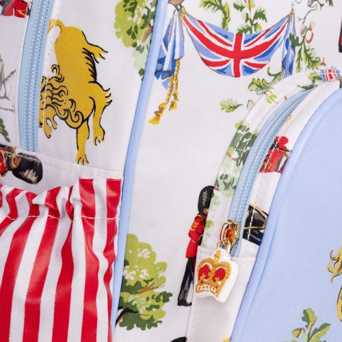 The Children's Royal Guard Backpack, featuring the new designs with Royal Guards marching through the woods trumpeting and drumming, as well lions  with the floral symbols of the four British nations and trees.  The front pocket is blue and features a lio