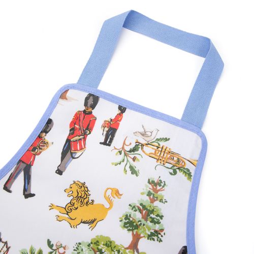 The Children's Royal Guard Apron, featuring the new designs with Royal Guards marching through the woods trumpeting and drumming, as well lions with the floral symbols of the four British nations and trees.  The front pocket features a white and red strip