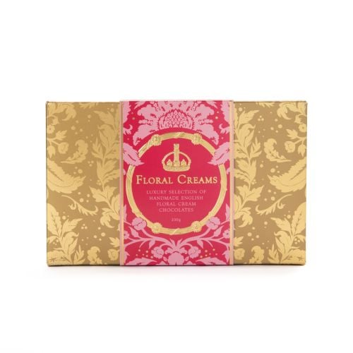 A box of English Floral Creams with gold embossed Acanthus packaging and a red band with "Floral Creams: Luxury selection of handmade English Floral Cream Chocolatese." 