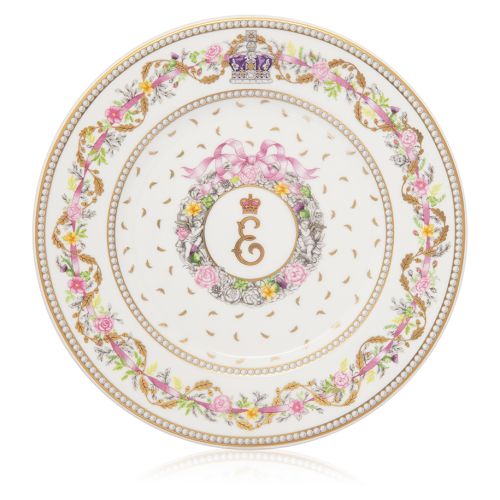 A small dessert plate with Queen Elizabeth II's personal cypher at centre. Surrounded by a floral design and pink ribbon on the edge of the plate with the Imperial State Crown at the top.  