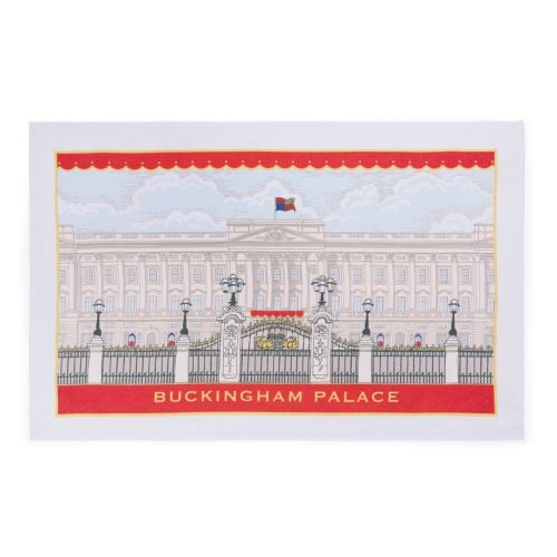 Facade tea towel of Buckingham Palace, including the Royal Standard and red band with Buckingham Palace printed in gold. 