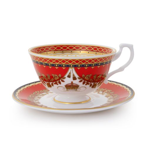 This Livey Teacup and Saucer featuring the royal coat of arms and a deep, rich scarlett edge and navy border with contrasting fine gold details, inspired by the intricate decorative braiding of hand-sewn livery and regimental devices of ceremonial uniform