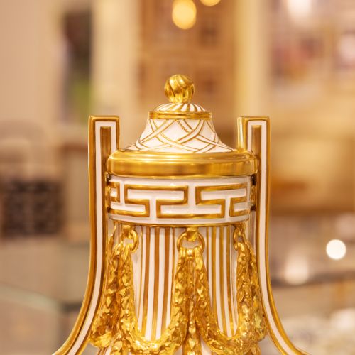 Golden and white Prestige Sèvres Vase with intricate designs and pattern.