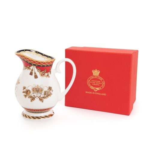 This Livery Cream Jug featuring the crown detail and a deep, rich scarlet edge and navy border with contrasting fine gold details, inspired by the intricate decorative braiding of hand-sewn livery and regimental devices of ceremonial uniform