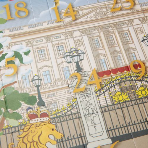 Front of our chocolate coin advent calendar with a snowy Buckingham Palace Facade featuring a lion and unicorn. 