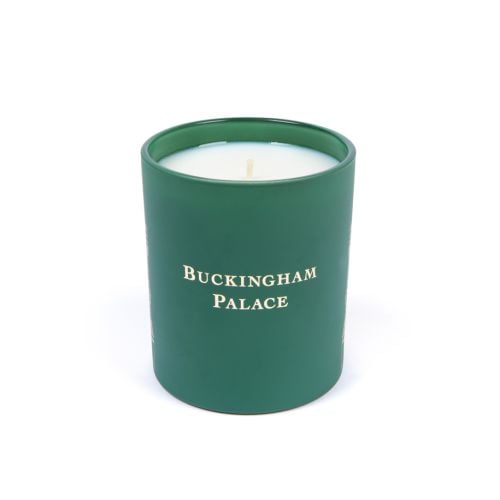 Green lit candle with Buckingham Palace Facade on front. 