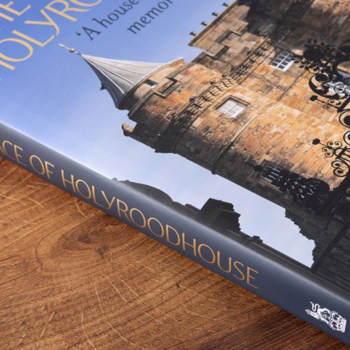 The Palace of Holyroodhouse 'A House Of Many Memories" book cover featuring the front of the Palace of Holyrood House on a sunny day. 