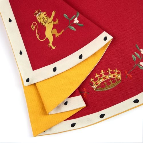 Red Children's cape with festive design decorated crowns and mistletoe. 