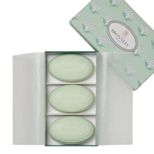 Bronnley Lily of the Valley with three green soap bars and Lily of the Valley patterned packaging . 