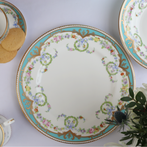 Great Exhibition fine bone china dinner plate with a design featuring gold plated rims, gold decorative and pastel coloured floral patterns. 