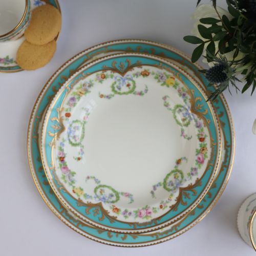 Great Exhibition fine bone china soup plate with a design featuring gold plated rims, gold decorative and pastel coloured floral patterns. 