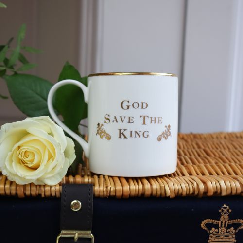 Wicker hamper with "Buckingham Palace" embossed on in gold, with  a tea towel, yellow Breakfast Tea Caddy, a jam and marmalade amd GSTK mug with Coat of Arms. 