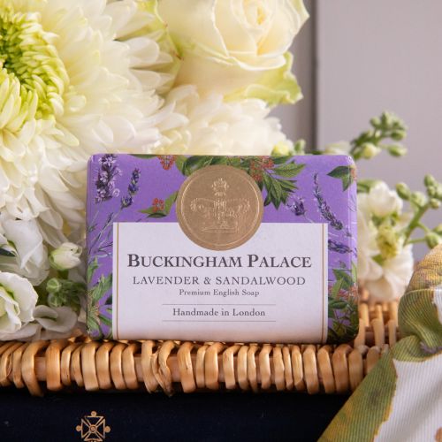 The From the Palace Garden Hamper featuring Chelsea Garden Gloves Set of 2 and Chelsea Garden Utility Belt with a botanical print featuring insects, lemons, and leaves  with green and purple detailing. Also featured is the Buckingham Palace Lavender and S