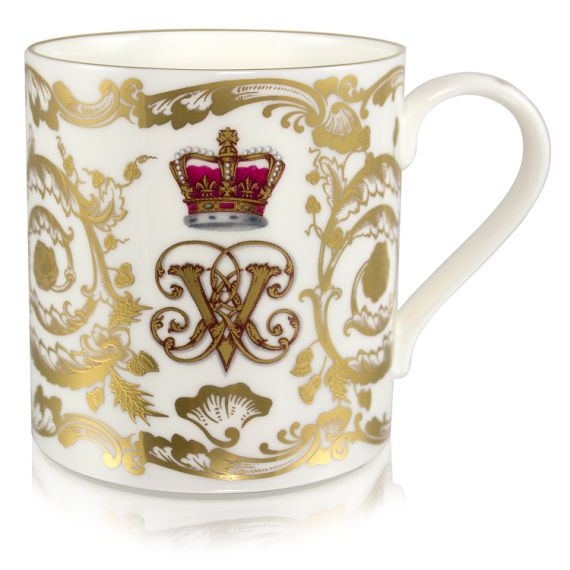 Victoria and Albert English fine bone china coffee mug featuring the ciphers of Queen Victoria and Prince Albert surmounted by a royal crown and surrounded by intricately ornated gold patterns.