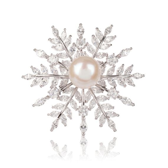 Snowflake crystal brooch with a pearl at the centre.