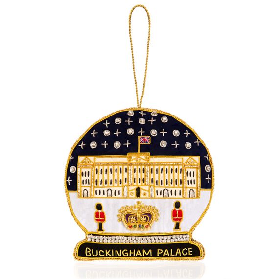 a snow globe shaped Christmas decoration depicting Buckingham Palace embroidered with gold threads and beads