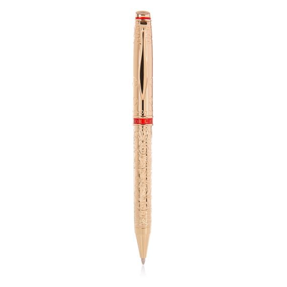 gold plated ballpoint pen with a swirl pattern and printed with 'Buckingham Palace'