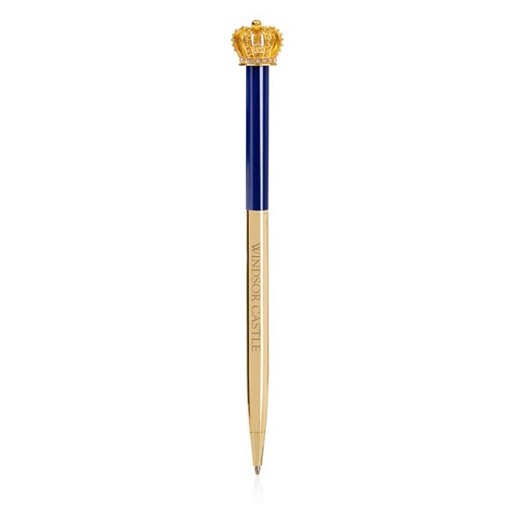 windsor castle pen. Topped with a gold coloured crown. The bottom half of the ballpoint pen is gold and the top half is blue