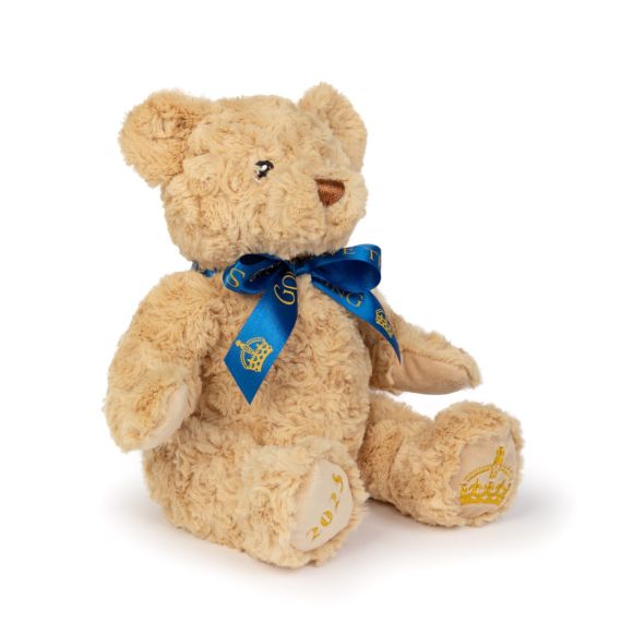 Teddy bear with blue God Save the King ribbon.