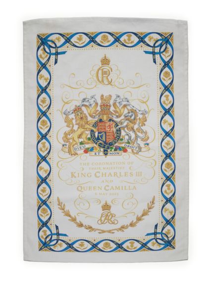 White tea towel with decorations.