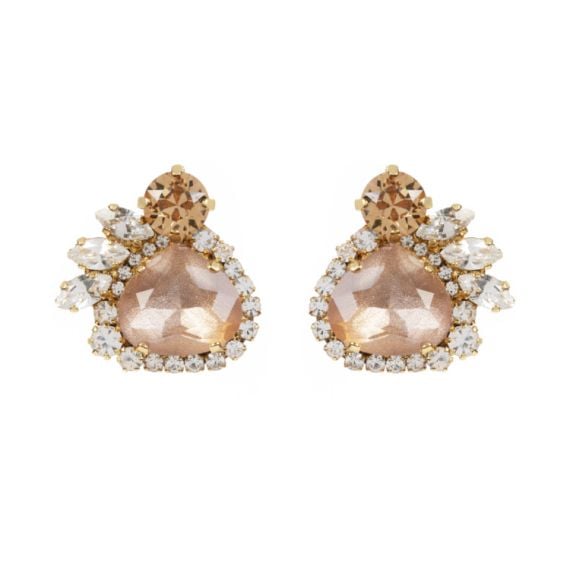 A pair of pale pink crystal earrings. Surrounded by an assortment of brown and clear crystals.