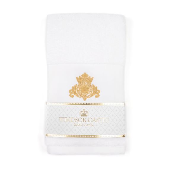 White hand towel with Windsor Castle crest. Wrapped with a gold and white label. 