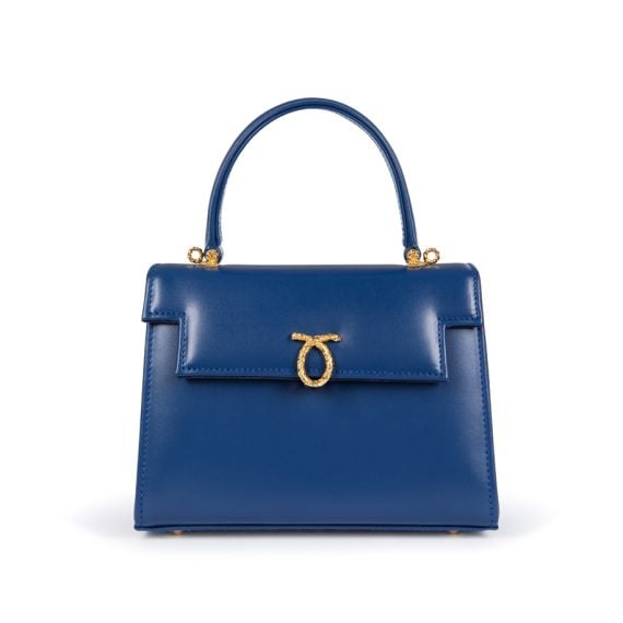 A blue leather handbag with top handle and gold coloured clasp