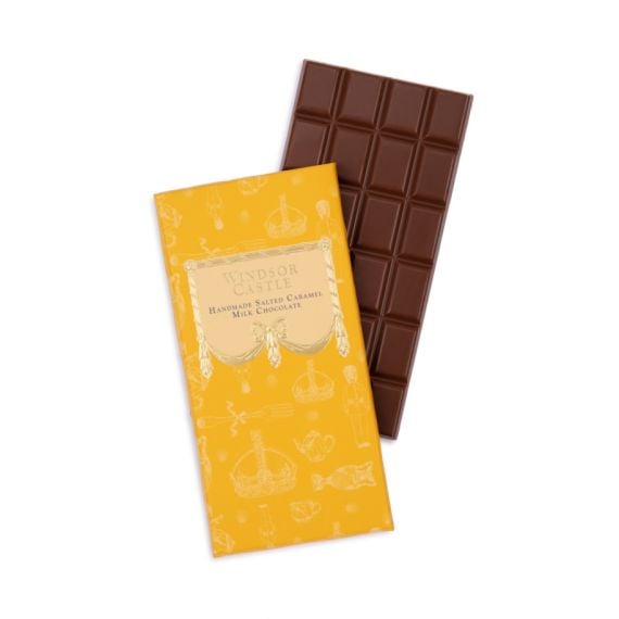 Bar of chocolate next to yellow packaging sleeve. Illustrated with items from the Royal Collection