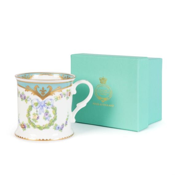 Great Exhibition Tankard with floral and blue detail, next to blue box embossed with "English Fine Bone China" and gold crown. 