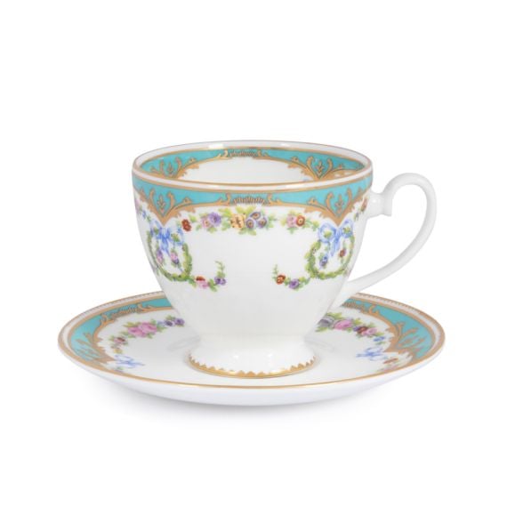 Great Exhibition fine bone china teacup and saucer with a design featuring gold plated rims, gold decorative and pastel coloured floral patterns on both parts.