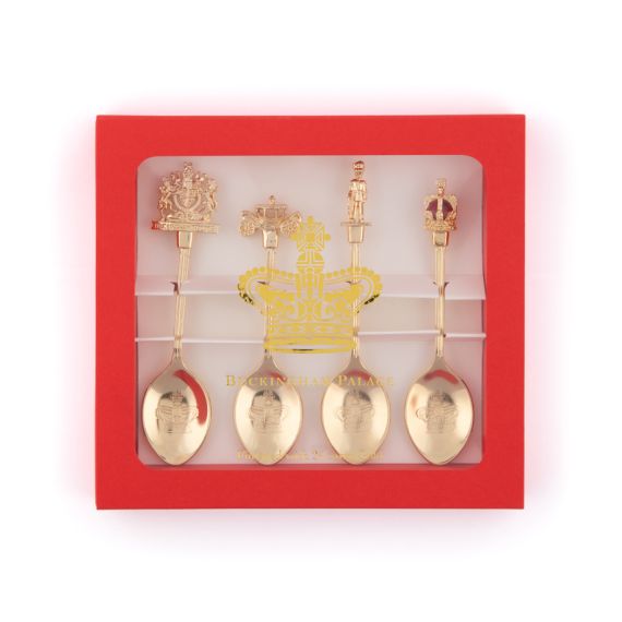 Gold Tea Spoons with various figures on the top, including royal crest, golden carriage, Gaurdsman and Crown in red packaging. 