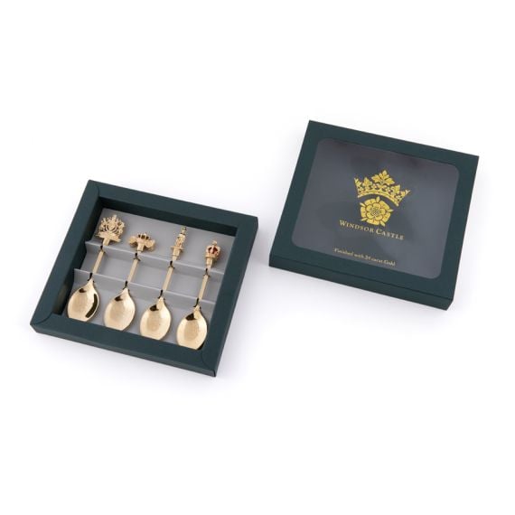 Windsor Castle Souvenir Spoon set with crown and tudor rose and four gold plated spoons featuring the royal crest, carriage, guardsman and crown. 