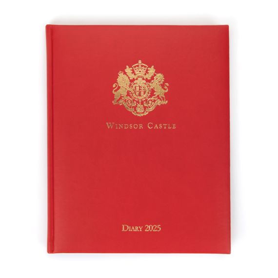 Red desk diary with gold embossed crest and lettering, Windsor Castle Diary 2025.