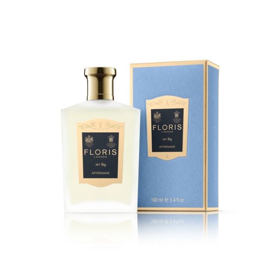 Floris London No 89 Gentleman's Aftershave bottle next to blue packaging with gold lid and royal warrant printed on label. 